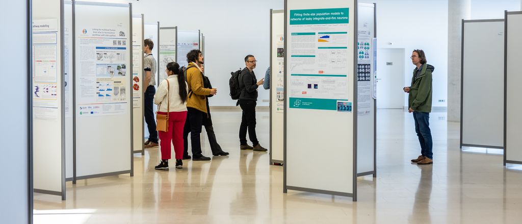 People looking at a scientific poster exhibition